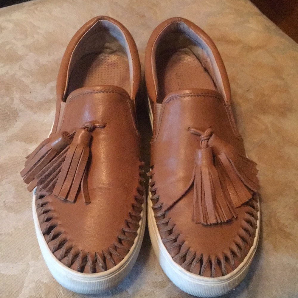 Tan and white shoes